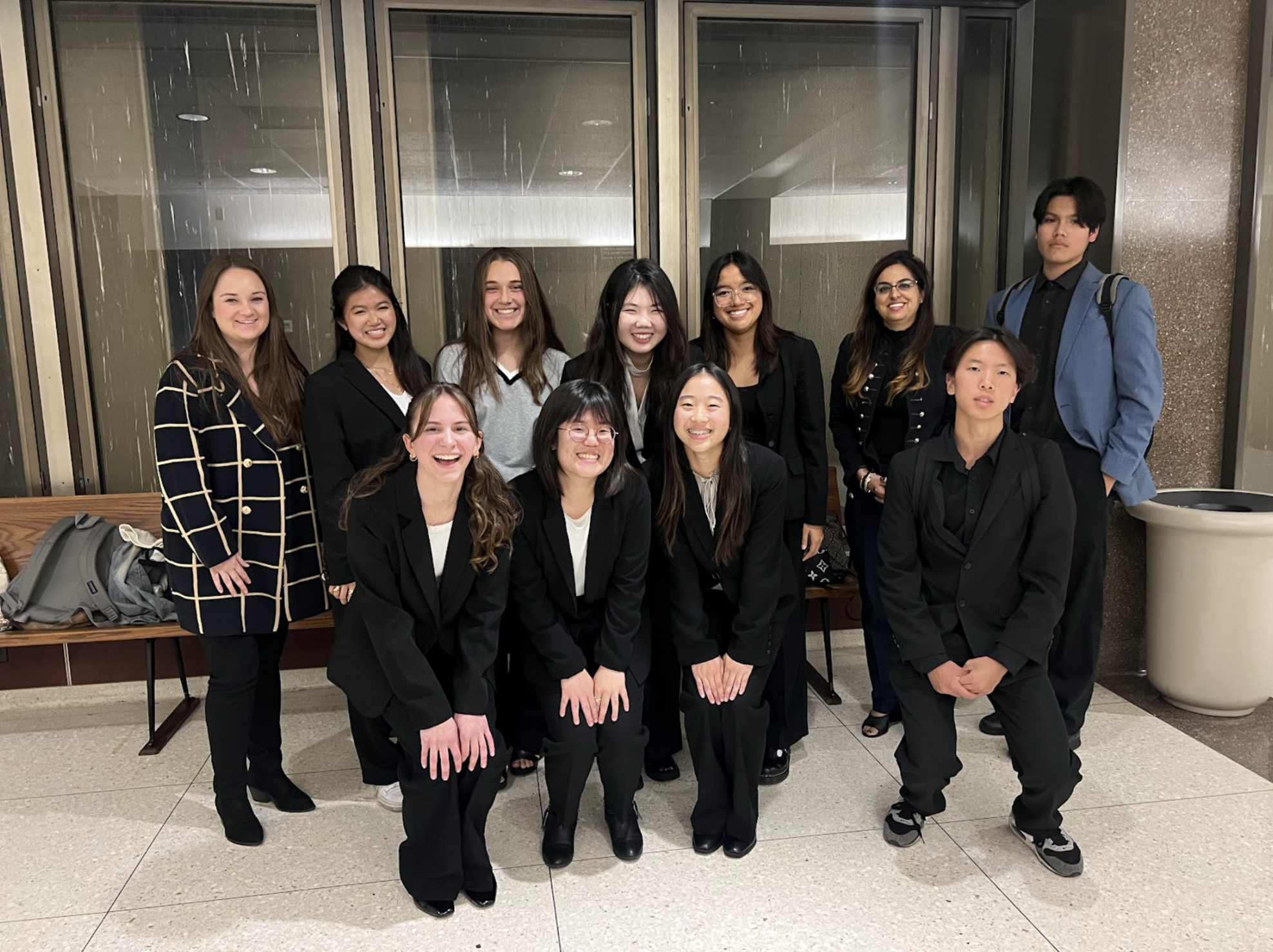 Members of the Mock Trial club gather to celebrate after their inaugural tournament season on Tuesday, Nov. 19, inside the Superior Court of California, County of Orange.